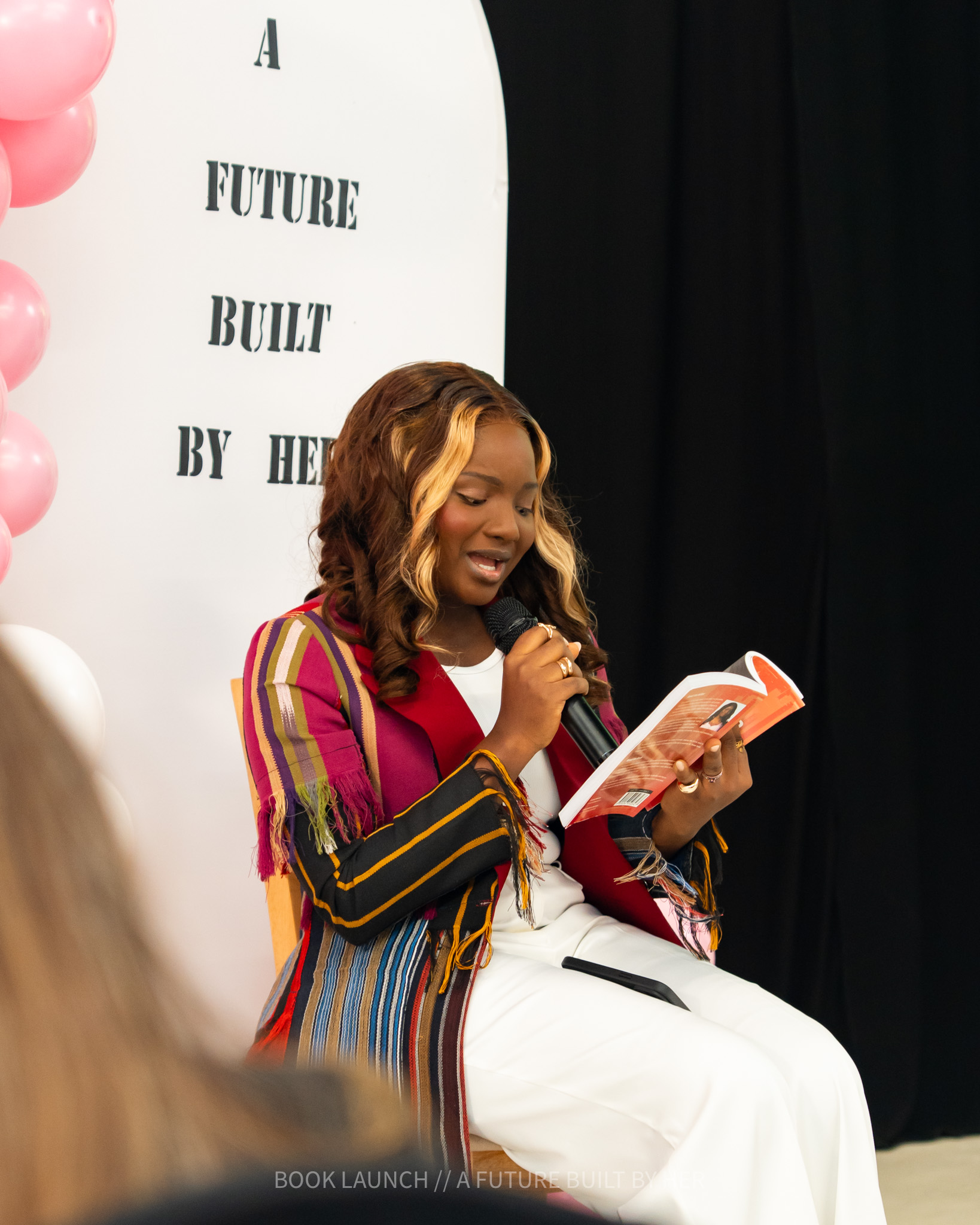 Grace Ajagbe reading from the book at launch