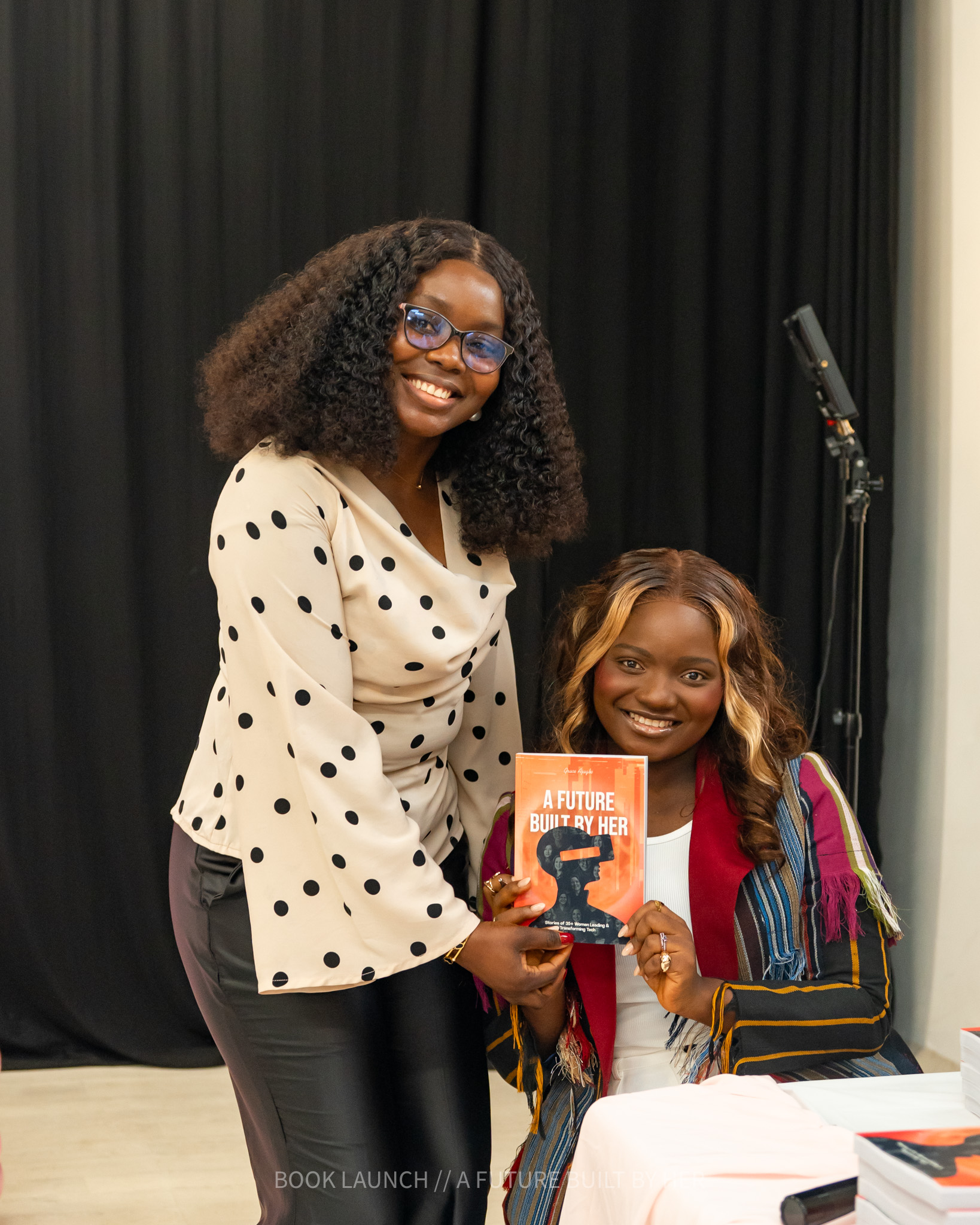 Author with guest during book signing
